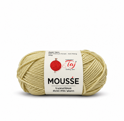A single skein of Mousse yarn in Ash Yarn, featuring a cream-colored label with a red yarn ball logo and text, set against a plain white background.