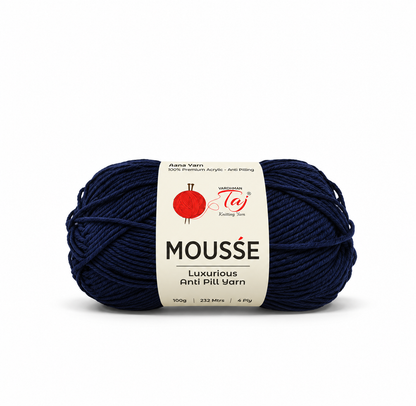 A single skein of Ane's Yarn Mousse Luxury Anti-Pill yarn in a deep navy blue color, wrapped with a white paper label featuring a red yarn ball logo.