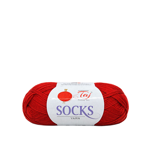 Red skein of yarn with a white label on a white background