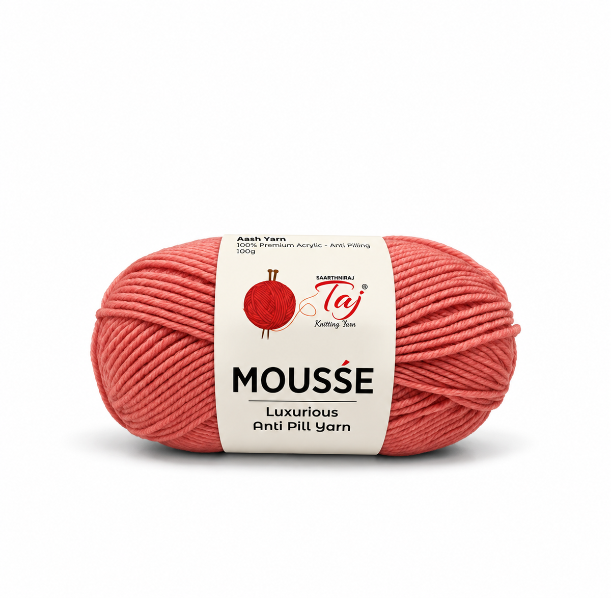 A skein of coral pink Mousse yarn with a white paper label, shown on a clean white background. The label features the brand 'Taj' and product details.