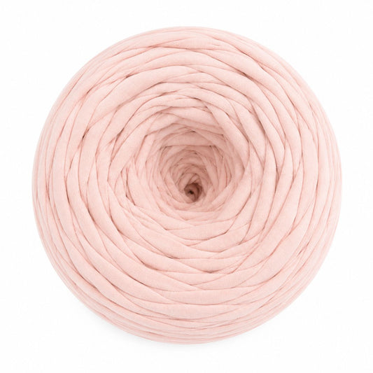 Pink yarn ball on a white background