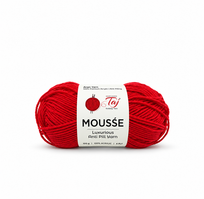 A single skein of bright red yarn with a white paper label reading 'Moussé Luxury Anti Pill Yarn' and the Taj Knitting Yarn logo, centered on a plain white background.