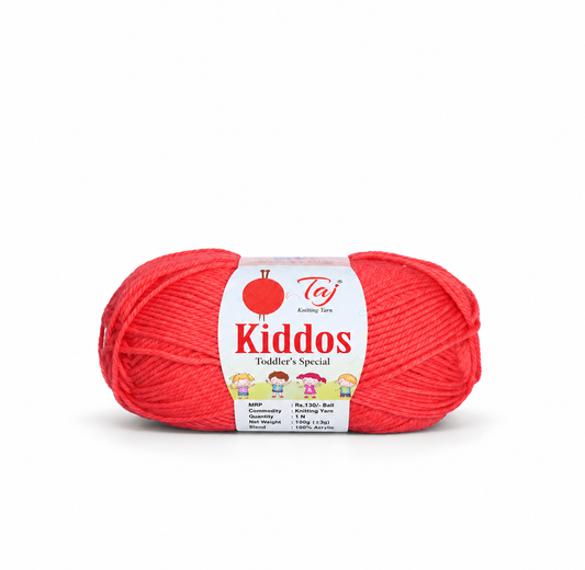 A skein of bright coral-red yarn with a white paper label reading 'Taj Kiddos Toddler's Special' on a clean white background.