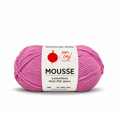 A single ball of Varentech Mousse Luxurious Anti Pill Yarn in a vibrant pink shade, featuring a white paper label with red and black branding, set against a plain white background.