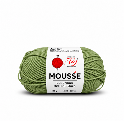 A single skein of Mousse Luxurious Anti Pill Yarn in sage green, featuring a white paper label with the Moussette and Madhumal Taj Knitting Yarn brands, on a white background.