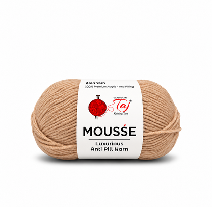 A single skein of Taupe Mousse knitting yarn with a white paper label, shown on a clean white background. The label features the brand name 'Tay' and product details.