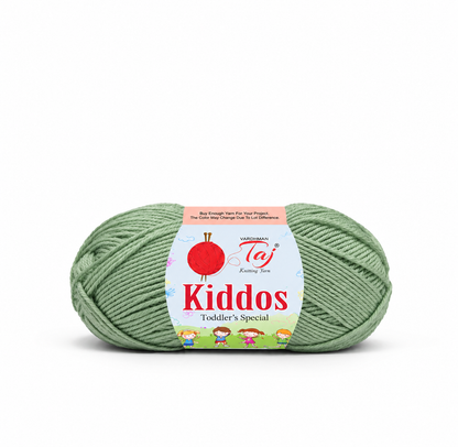 A ball of sage green yarn with a colorful paper label reading 'Kiddos Toddler's Special' and 'Vandorah Taj Knitry Tee,' photographed on a clean white background.