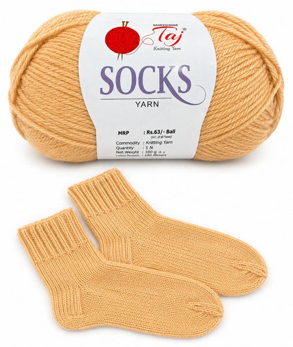 Ball of socks yarn and a pair of knitted socks on a white background