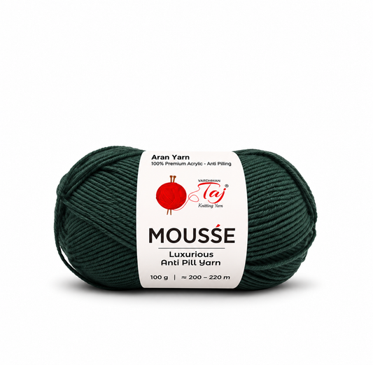 A single skein of Wessgarman Aran Yarn in the color Mousse, which is a deep forest green. The yarn is wrapped with a white paper label showing the brand logo and product details, set against a plain white background.