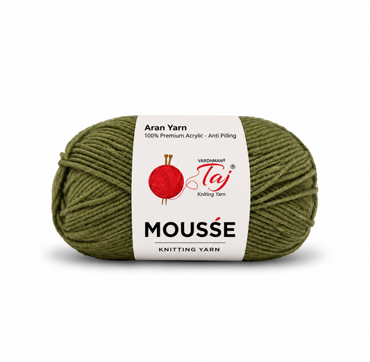 A skein of olive green knitting yarn with a white paper label featuring the brand 'Waechmann Taj' and product name 'Mousse Knitting Yarn'.