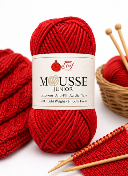 Red yarn ball with 'Mousse Junior' label 