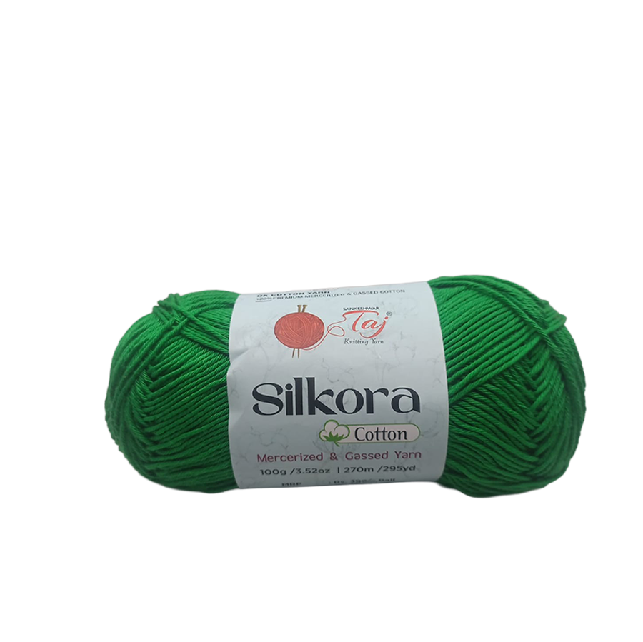 Green skein of Silkora Cotton yarn on a white background