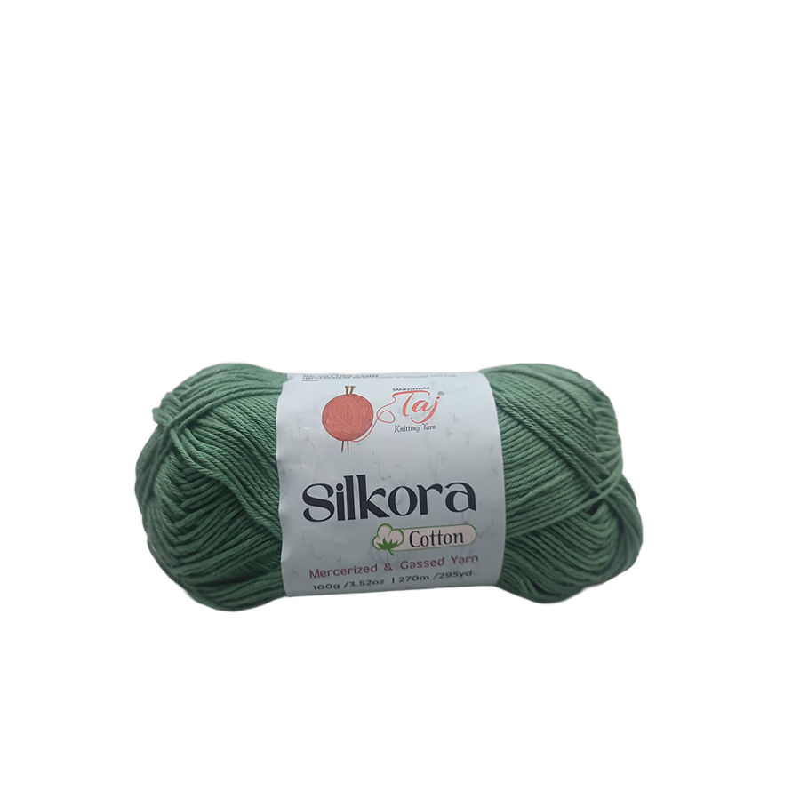 Green skein of Silkora Cotton yarn on a white background